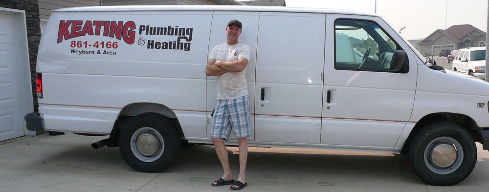 Man Standing in Front of Keating Plumbing & Heating Van